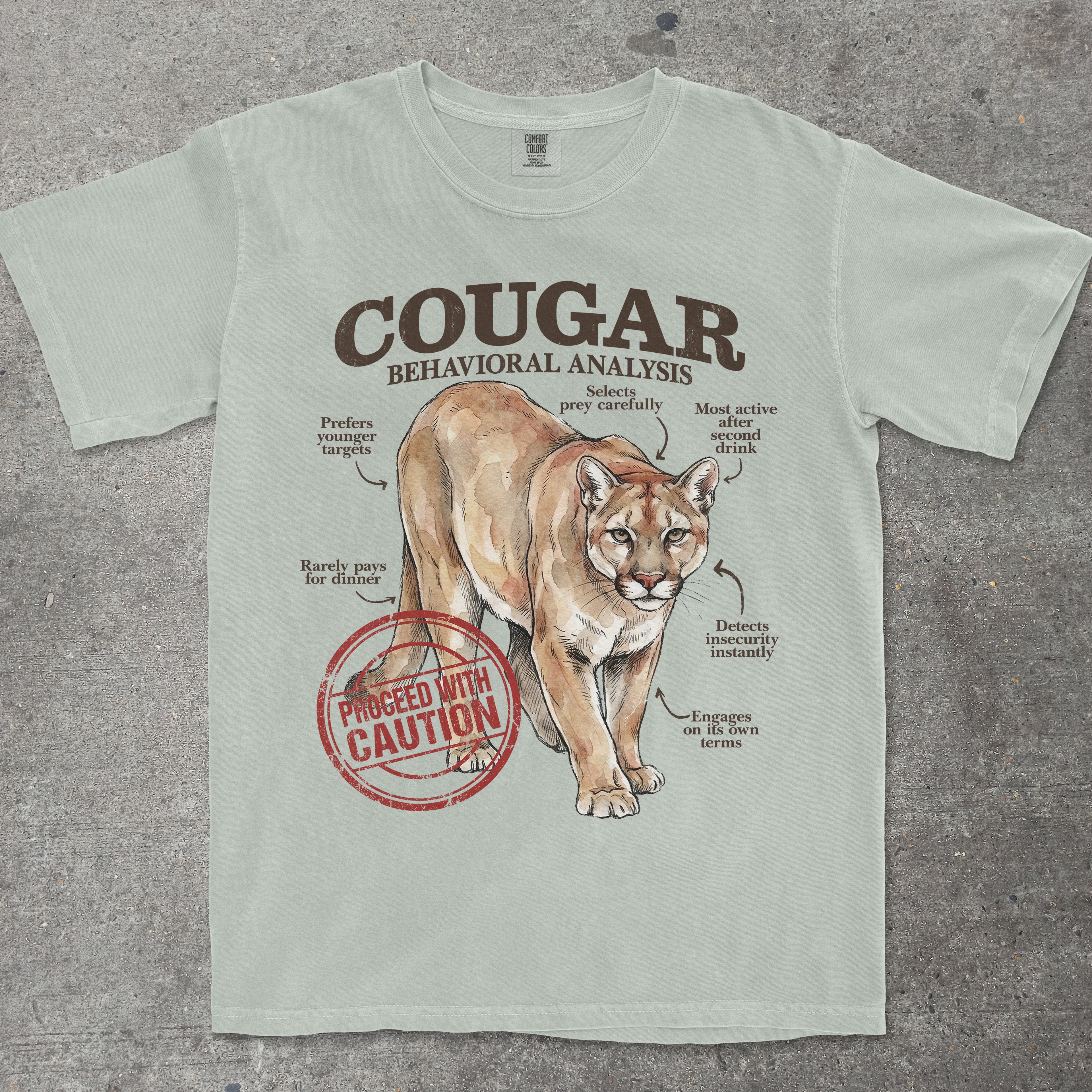 T-shirt with a cougar graphic and text on a textured surface