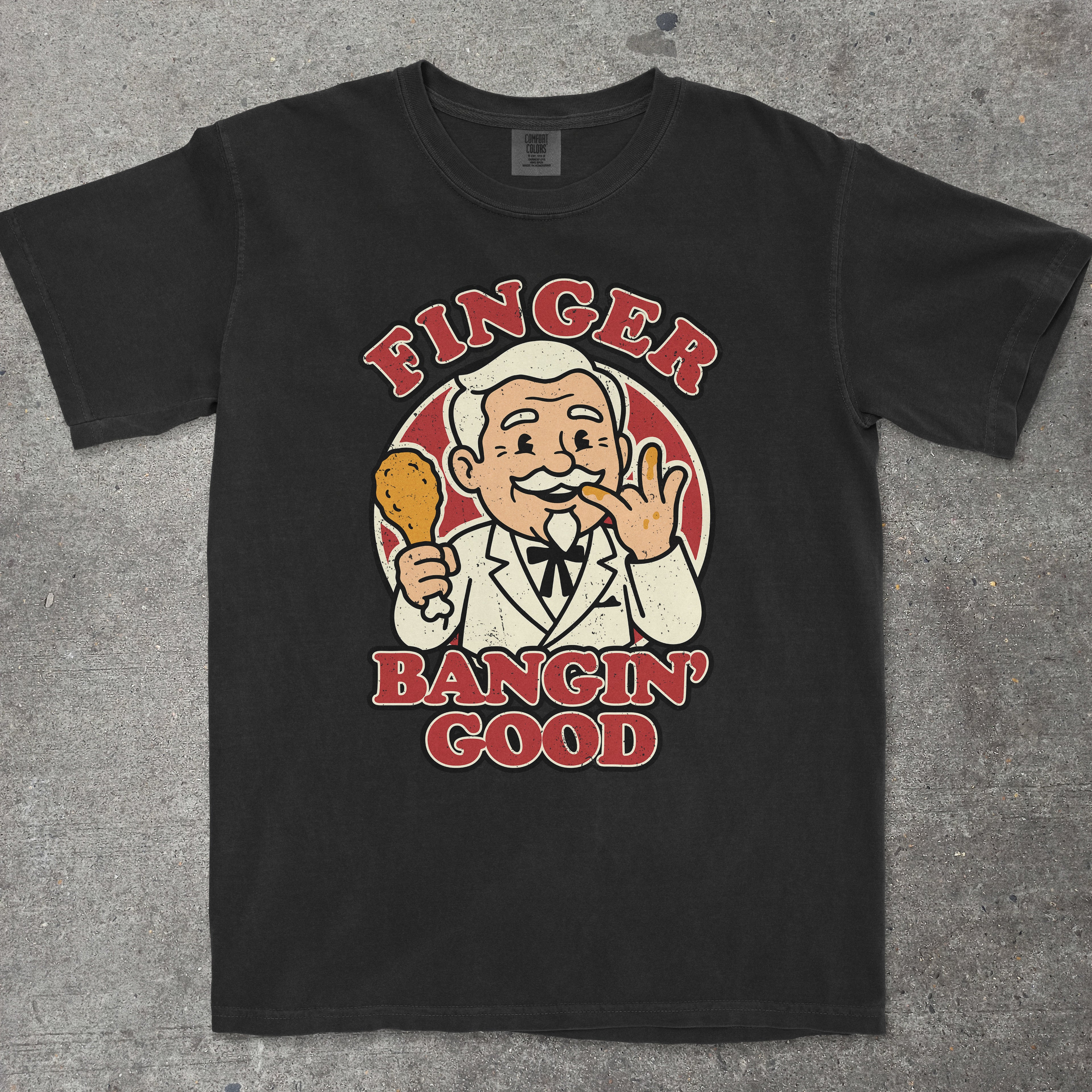 Black graphic tee featuring smug vintage mascot with "Finger Bangin Good" text by TeeHeeUSCo