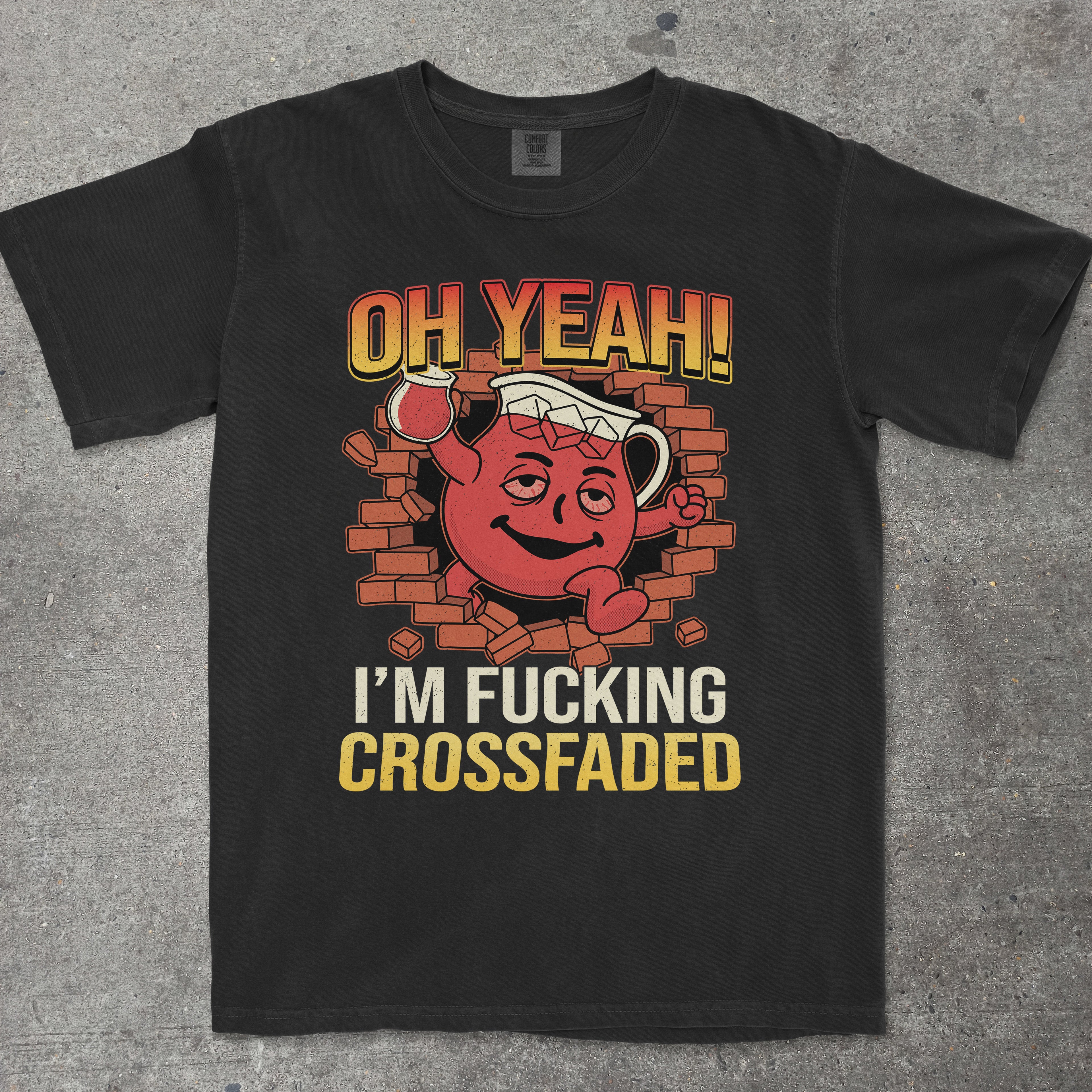Black t-shirt with a graphic design featuring a red character and text on a gray surface