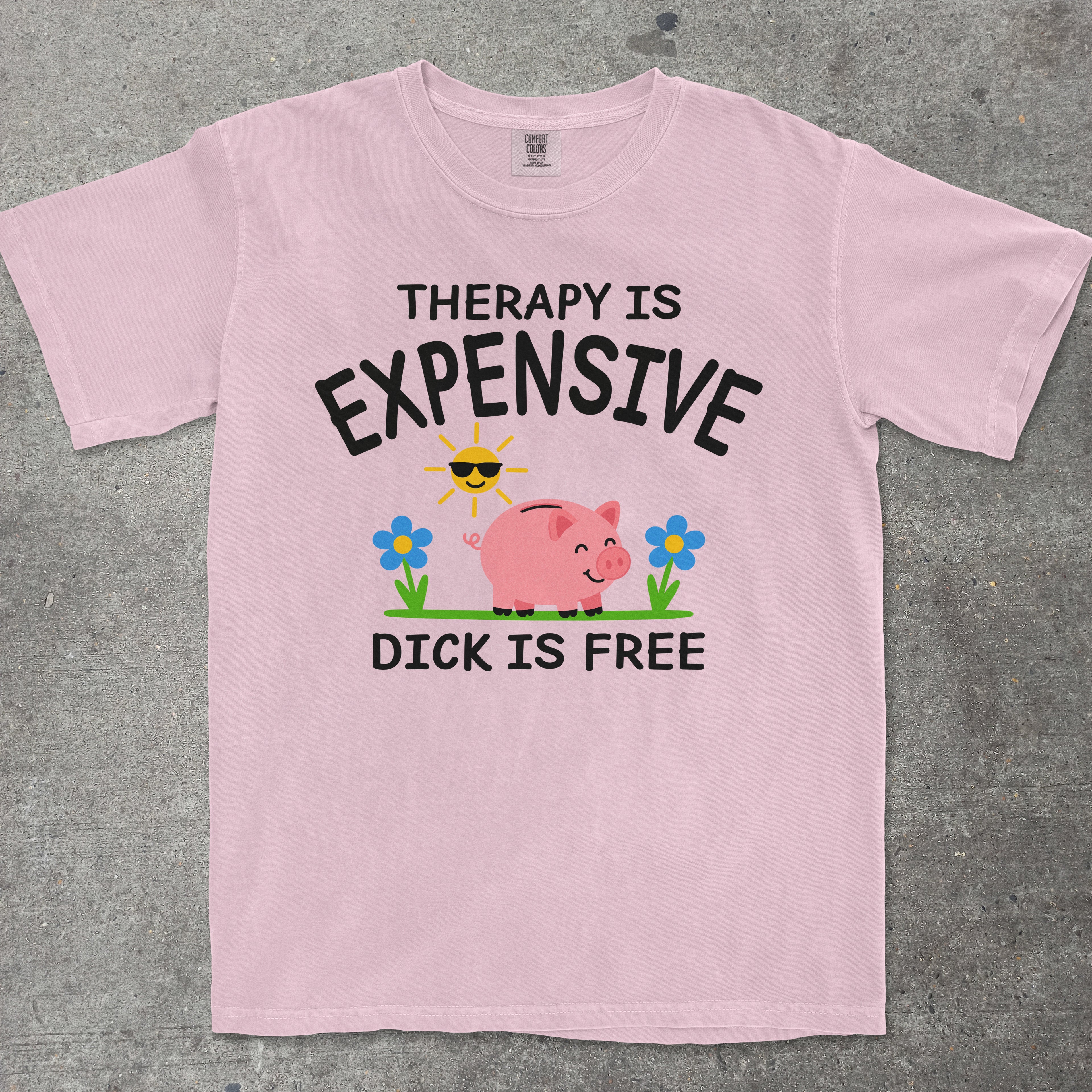 TeeHeeUSCo THERAPY IS EXPENSIVE DICK IS FREE Pink flat lay graphic tee
