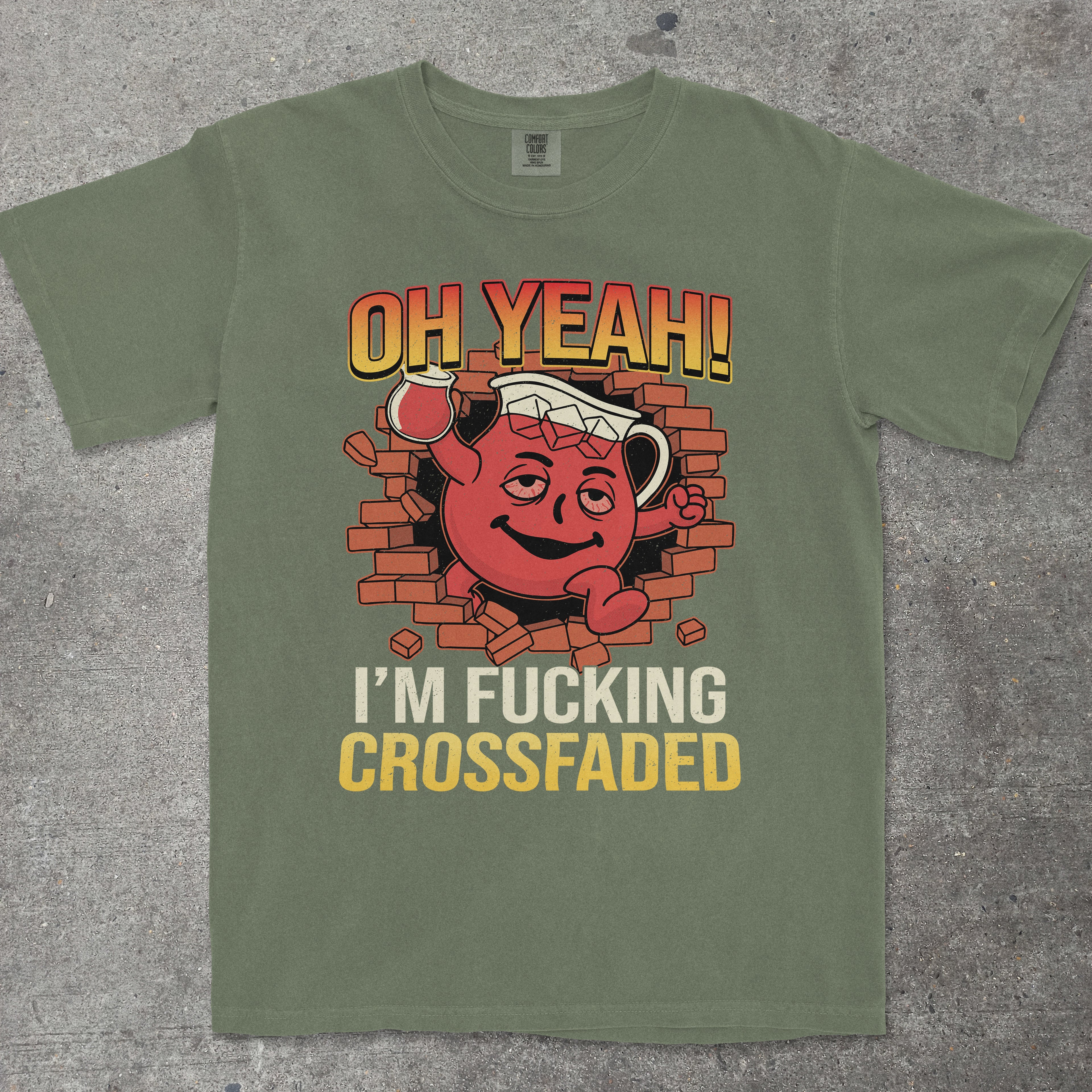Green t-shirt with a graphic design and text on a gray surface