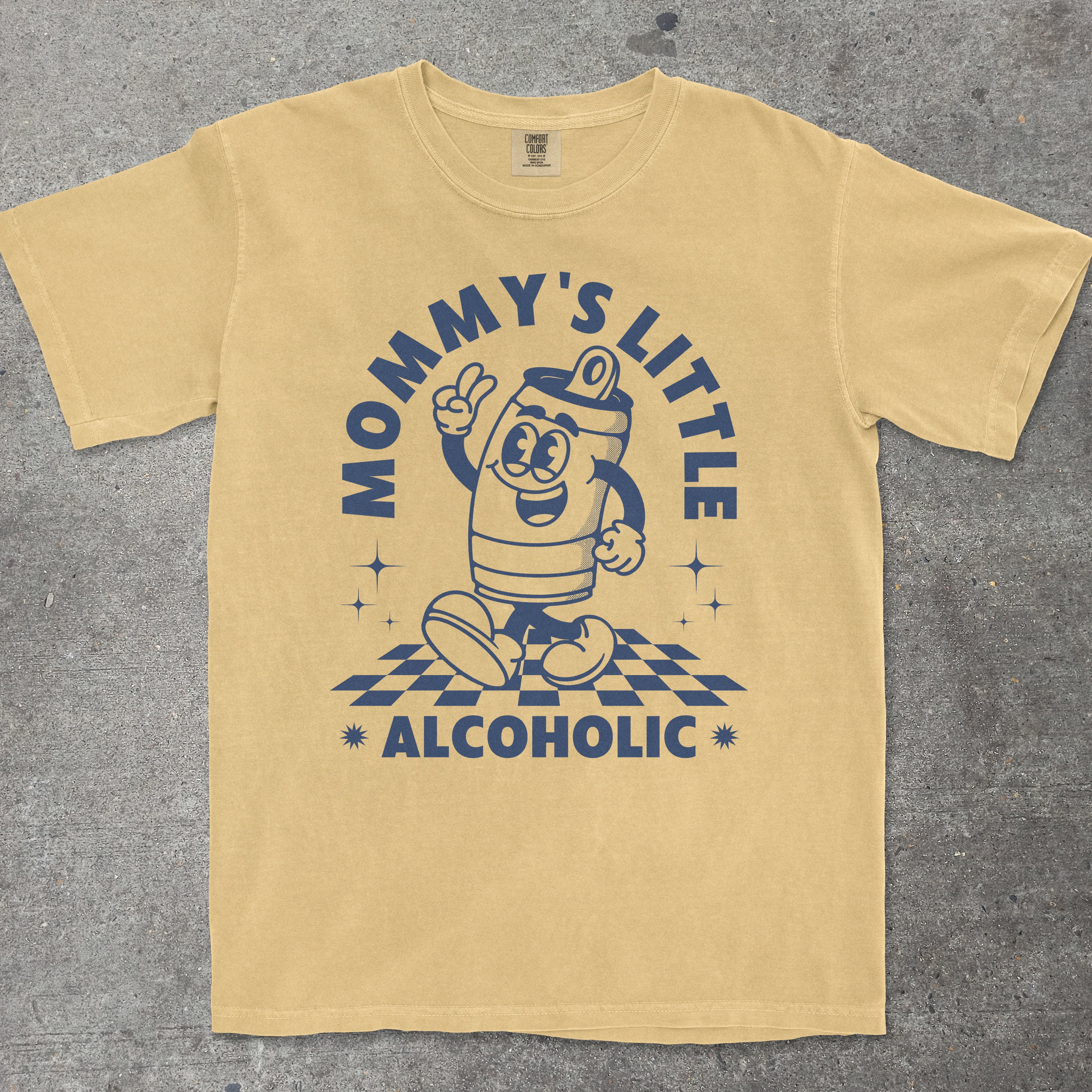 Yellow t-shirt with a graphic design and text on a gray surface