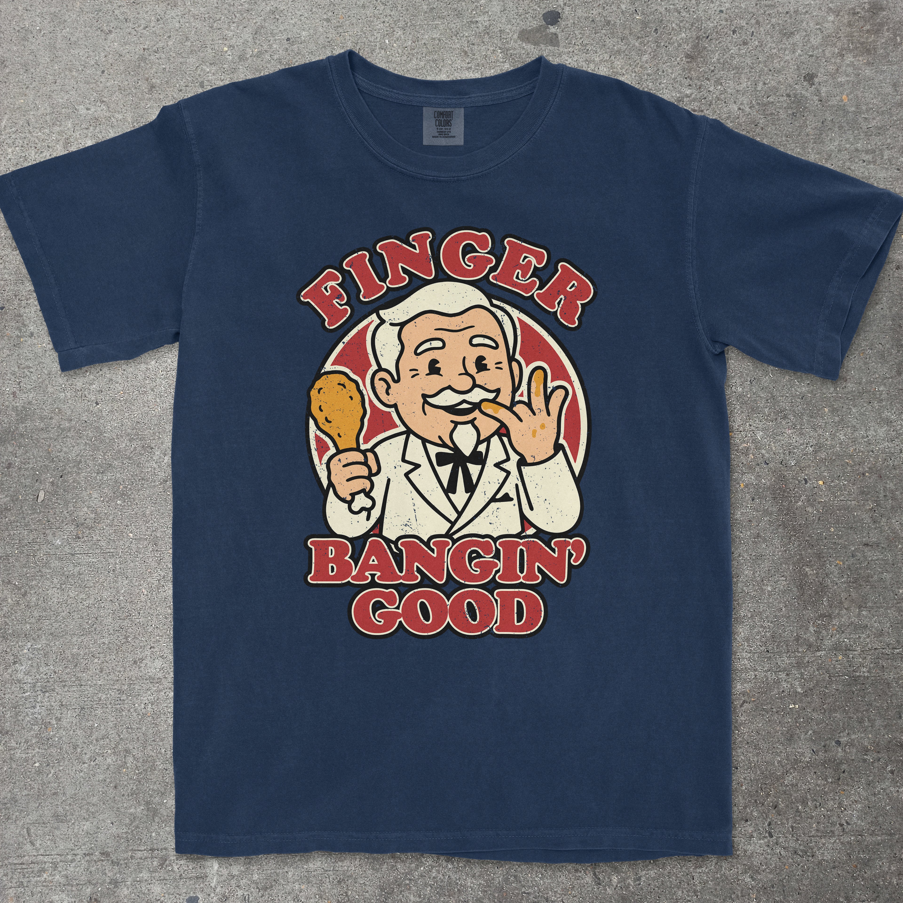 Navy graphic tee with retro mascot character and "Finger Bangin' Good" text design by TeeHeeUSCo