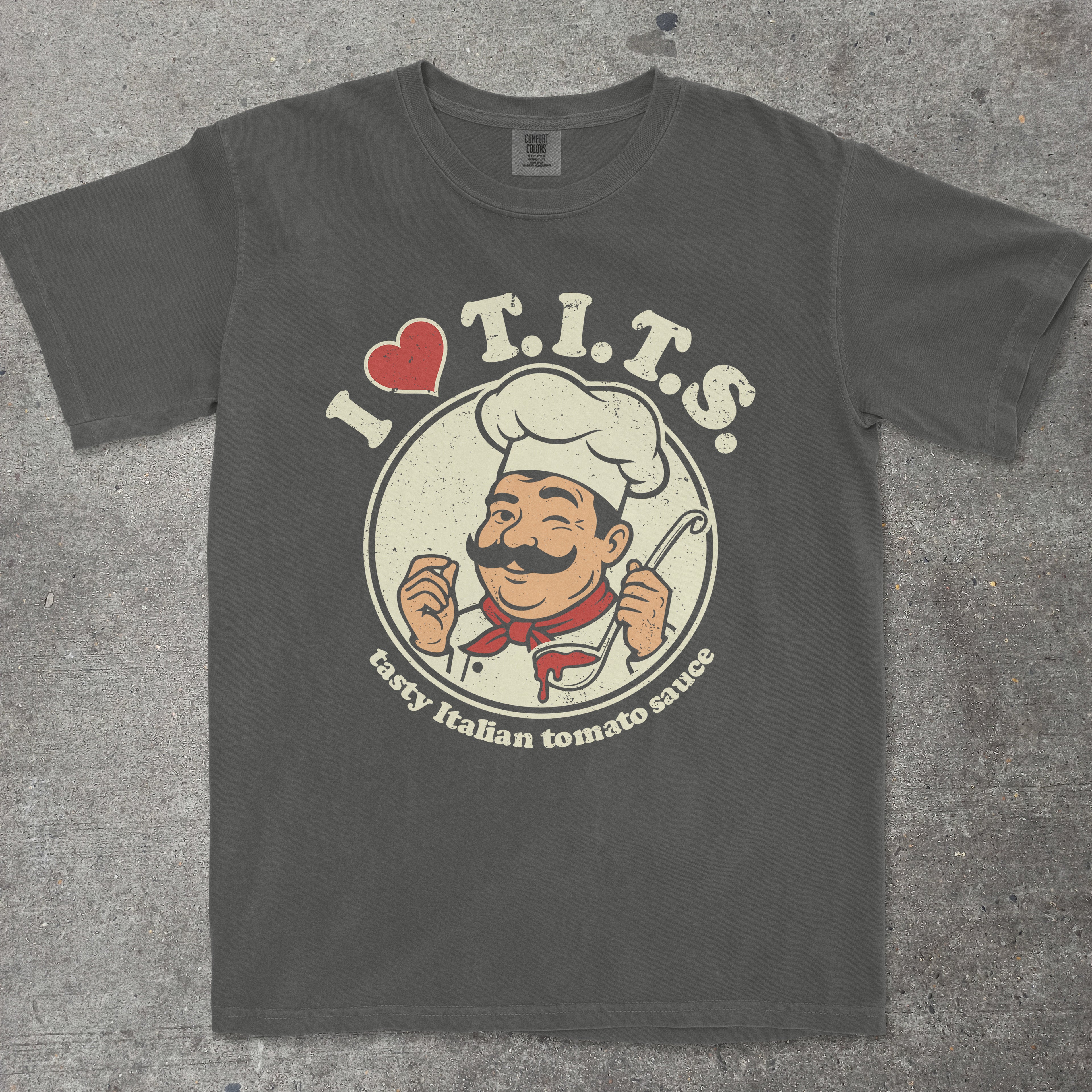 Pepper gray graphic tee featuring retro chef mascot with "I LOVE T.I.T.S." text design by TeeHeeUSCo