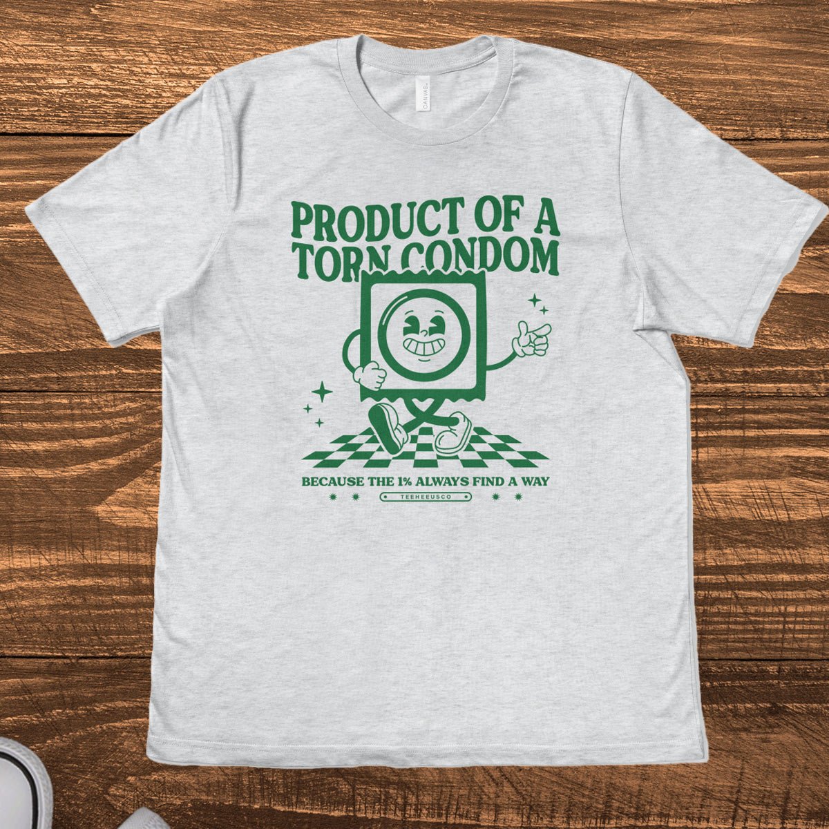 Retro mascot character on heather gray graphic tee with "Product of a Torn Condom" text - TeeHeeUSCo