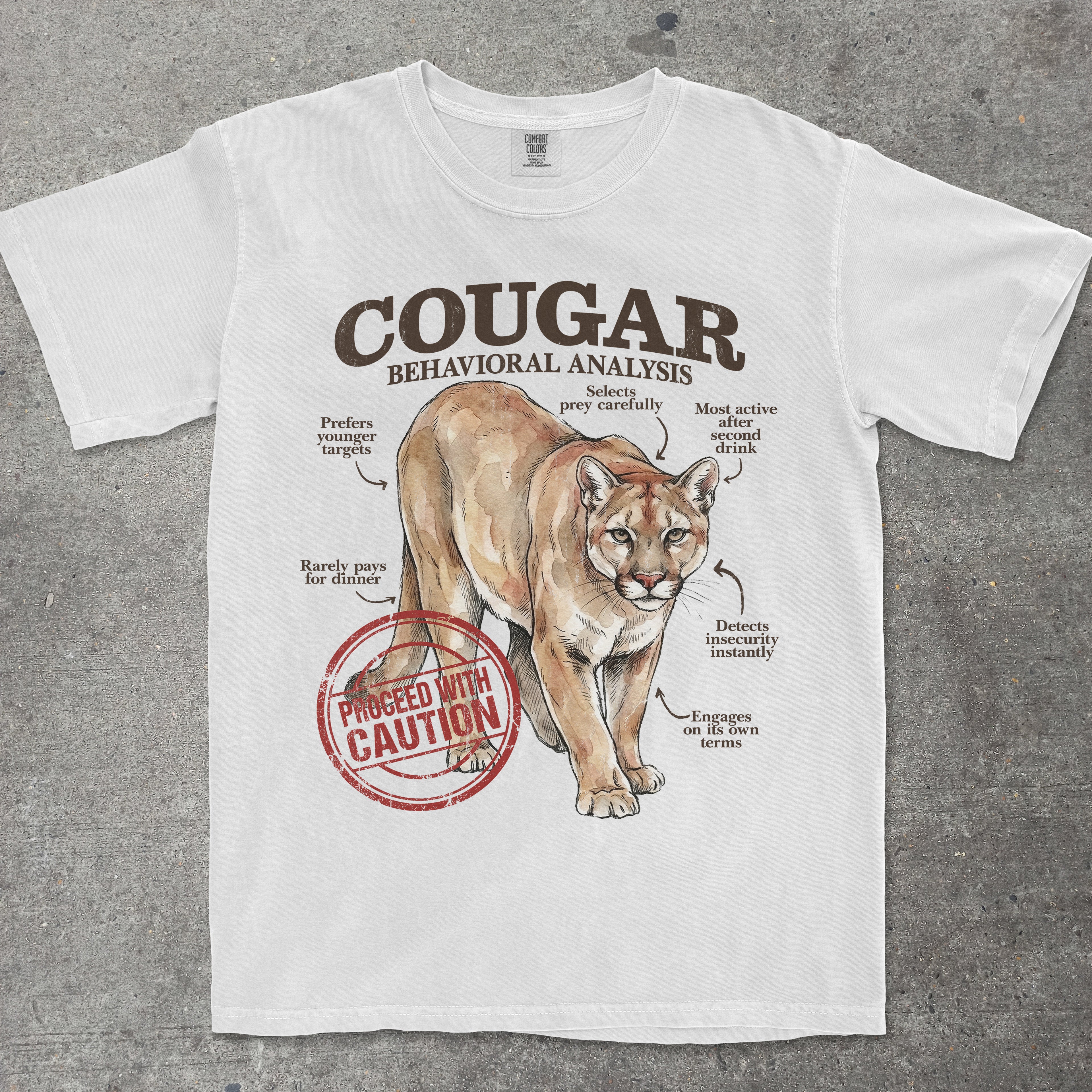 White t-shirt with a cougar graphic and text on a gray background